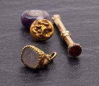 A Victorian yellow metal propelling pencil with seal top, together with a fob seal,