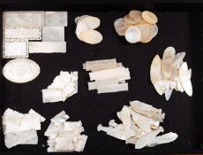 A collection of Mother-of-pearl Mah-Jong counters in an associated mahogany cutlery case.