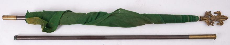 A green Scouts flag on a flagpole inscribed 'Be Prepared' with gilt brass finial