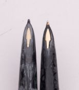 Two Parker 61 gold plated fountain pens.