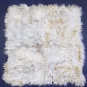 A White Goat skin rug,