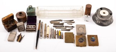 A silver propelling pencil, together with three others and a small collection of inkwells etc.
