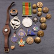 A World War II Defence Medal, together with a Tank Corps cap badge,