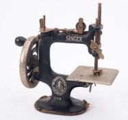 A Child's toy sewing machine by Singer,