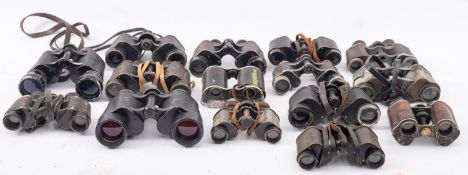 A collection of uncased binoculars, various makers including Ross,