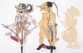 A group of four Javanese Wayang Kulit (shadow puppets) of traditional design together with a Wayang