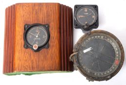 A Jaeger watch company model 43A-4 cockpit clock together with an Elgin Pioneer cockpit clock and a