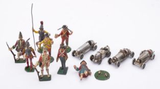 A group of seven of hand painted lead soldiers with four mid 20th century alloy racing car models,