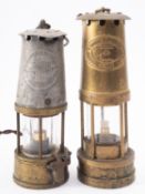 Two vintage miner's lamps, one alloy and brass Prestwich Paten number 26, the other E.