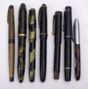 A group of seven various fountain pens, including a green marbled Sheaffer,