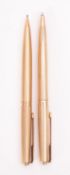 A 9 carat gold ballpoint pen and pencil by Parker Pen Co.
