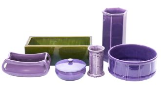 A Bretby green glazed flower trough, together with a small group of purple glazed earthenwares.