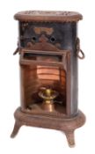 An Edwardian 'Petrolux' iron and cast me