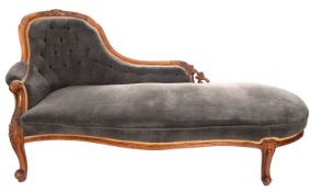 A Victorian carved walnut and upholstere