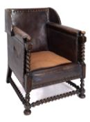 A leather covered and brass studded armc