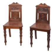 A pair of 19th Century walnut hall chair