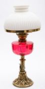 A late Victorian brass oil lamp with ree