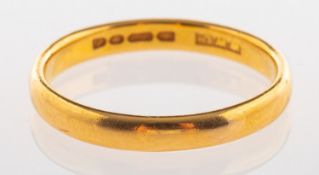 A 22ct yellow gold wedding band, UK hallmark, size O, 3.3grams.