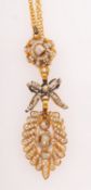 An antique pearl pendant with chain,