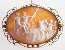 A large oval cameo, in an openwork and bead frame, depicting figures & horses, safety chain,