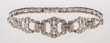 An Art Deco diamond bracelet, of openwork geometric design and square settings,