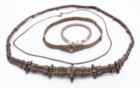 A group of early 20th century Indian silver wedding jewellery including;