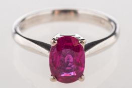 A single stone ruby ring, claw set with an oval-cut ruby, ruby approx. 1.