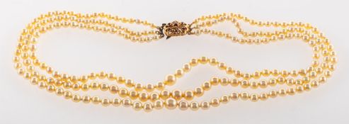 A late 1950's triple row pearl necklace, three rows of graduated cultured pearls,