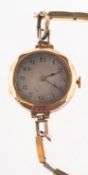 A 9ct gold lady's wristwatch the movement having a lever escapement and stamped Swiss Made,