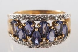 A 9ct gold iolite and diamond ring, set to the centre with eight pear-shaped iolite stones,