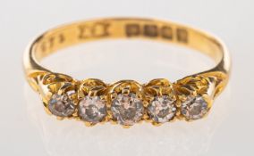 An 18ct gold five stone diamond ring,