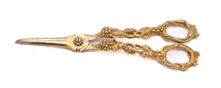 A pair of Victorian silver-gilt Pierced Vine pattern grape scissors by Charles Rawlings & William