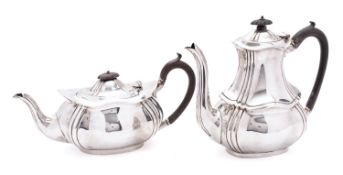 An Edward VII silver coffee pot and tea pot, maker's marks rubbed out, Sheffield 1905,
