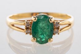 An emerald and diamond ring,
