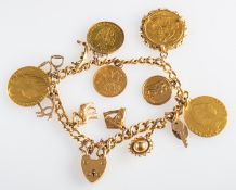 An 18ct gold charm bracelet with heart padlock, including five 9ct gold charms, three 18ct charms,