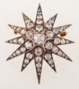 A fine Victorian diamond star brooch pendant, grain set with an array of rose-cut,