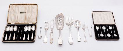 A small group of silver flatware;