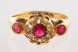 An 18ct gold antique ring, set with three circular-cut red paste stones,