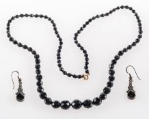 A bead necklace & earrings, a long string of graduated faceted black beads, length approx. 68.