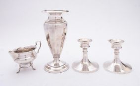 A mixed group of silver; including a pair of dressing table candlesticks by Jones & Crompton,