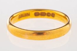 A 22ct yellow gold wedding band, UK hallmarks, size J, 3.3grams.