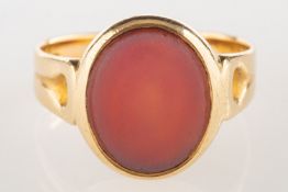 A Victorian 18ct gold signet ring, set with an oval plaque of carnelian, UK hallmark, size Q, 5.