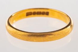 A 22ct yellow gold wedding band, UK hallmark, size L1/2, 3.2grams.