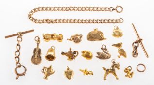 A curb link bracelet and charms, a curb link bracelet, marked 375, length approx. 21.0cm, 14.