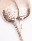 A pair of George V silver Picture Back Dog Nose tablespoons by Thomas Bradbury & Son,