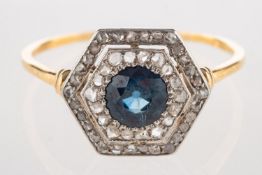 An Art Deco sapphire and diamond hexagonal ring, set to the centre with a circular-cut sapphire,