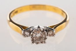 An Art Deco three stone diamond ring, illusion set to the centre with an old-cut diamond,