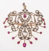 An impressive Victorian diamond and ruby brooch/pendant, an ornate openwork brooch/pendant,