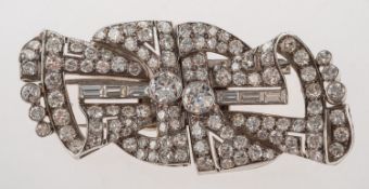 A fine and impressive Art Deco diamond brooch and dress clips,