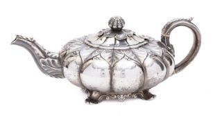 A George IV silver tea pot by Thomas Blagden & Co, Sheffield , 1827, of compressed form,